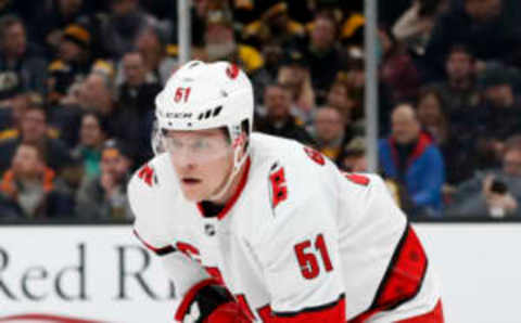 BOSTON, MA – DECEMBER 03: Carolina Hurricanes defenseman Jake Gardiner (51) sets up for a face off during a game between the Boston Bruins and the Carolina Hurricanes on December 3, 2019, at TD garden in Boston, Massachusetts. (Photo by Fred Kfoury III/Icon Sportswire via Getty Images)