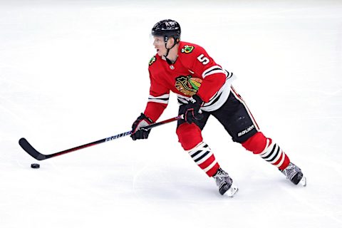 CHICAGO, ILLINOIS – APRIL 13: Connor Murphy #5 of the Chicago Blackhawks controls the puck during a game against the Philadelphia Flyers at the United Center on April 13, 2023 in Chicago, Illinois. The Flyers defeated the Blackhawks 5-4 in overtime. (Photo by Stacy Revere/Getty Images)