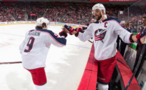 DETROIT, MI – NOVEMBER 26: Artemi Panarin #9 of the Columbus Blue Jackets pounds gloves with teammate Nick Foligno #71 on the bench following his first period goal during an NHL game against the Detroit Red Wings at Little Caesars Arena on November 26, 2018 in Detroit, Michigan. (Photo by Dave Reginek/NHLI via Getty Images)