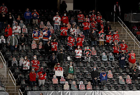 Fans stand for the national anthem. (Photo by Elsa/Getty Images)