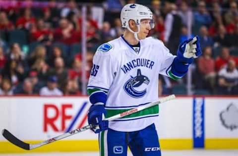 Apr 7, 2016; Calgary, Alberta, CAN; Vancouver Canucks right wing Jannik Hansen (36) during the face off against the Calgary Flames during the third period at Scotiabank Saddledome. Calgary Flames won 7-3. Mandatory Credit: Sergei Belski-USA TODAY Sports