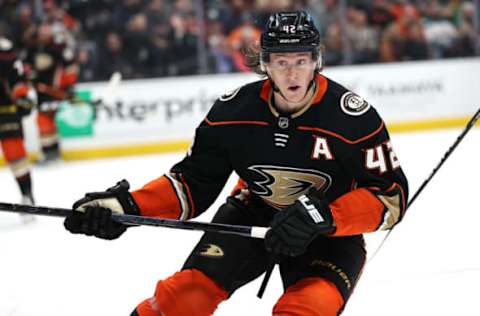 ANAHEIM, CALIFORNIA – NOVEMBER 18: Josh Manson #42 of the Anaheim Ducks skates to a loose puck during the second period of a game against the Carolina Hurricanes at Honda Center on November 18, 2021 in Anaheim, California. (Photo by Sean M. Haffey/Getty Images)