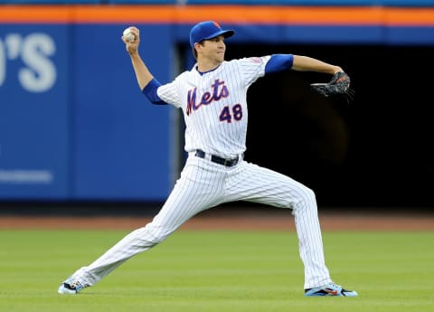 NEW YORK, NY – MAY 02: Jacob deGrom #48 of the New York Mets warms up in the outfield before the game against the Atlanta Braves on May 2, 2018 at Citi Field in the Flushing neighborhood of the Queens borough of New York City. (Photo by Elsa/Getty Images)