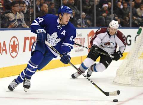 Dec 11, 2016; Toronto, Ontario, CAN; Toronto Maple Leafs defenceman Morgan Rielly (44) skates with the puck as Colorado Avalanche forward Nathan MacKinnon (29) pursues in the first period at Air Canada Centre. Mandatory Credit: Dan Hamilton-USA TODAY Sports