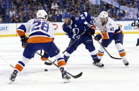 Apr 27, 2016; Tampa, FL, USA; New York Islanders center Frans Nielsen (51) and defenseman Marek Zidlicky (28) defend Tampa Bay Lightning right wing Ryan Callahan (24) during the third period in game one of the second round of the 2016 Stanley Cup Playoffs at Amalie Arena. The Islanders defeated the Lightning 5-3. Mandatory Credit: Kim Klement-USA TODAY Sports