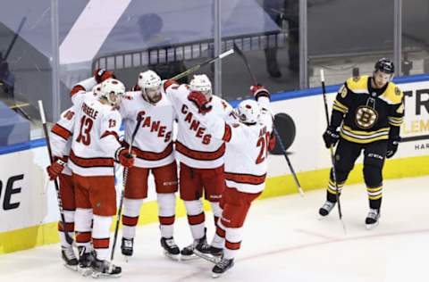 The Carolina Hurricanes celebrate a goal by Joel Edmundson #6 (Photo by Elsa/Getty Images)