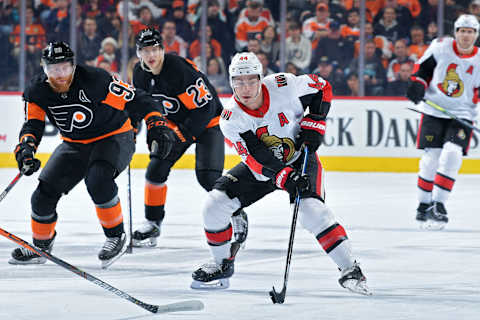 PHILADELPHIA, PA – DECEMBER 07: Jean-Gabriel Pageau #44 of the Ottawa Senators skates into the offensive zone ahead of Jakub Voracek #93 and Oskar Lindblom #23 of the Philadelphia Flyers in the first period at Wells Fargo Center on December 7, 2019 in Philadelphia, Pennsylvania. (Photo by Drew Hallowell/Getty Images)