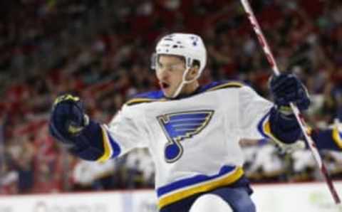 Feb 28, 2016; Raleigh, NC, USA; St. Louis Blues forward Ty Rattie (18) celebrates his first period goal against the Carolina Hurricanes at PNC Arena. Mandatory Credit: James Guillory-USA TODAY Sports