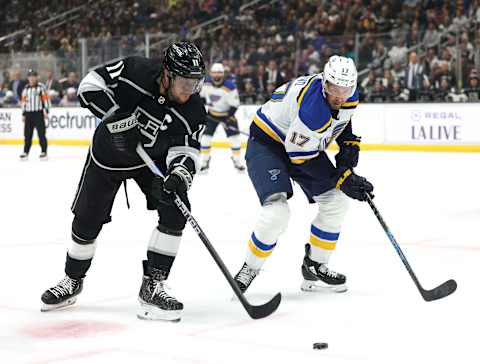 LOS ANGELES, CALIFORNIA – MAR. 04: Anze Kopitar #11 of the Los Angeles Kings and Josh Leivo #17 of the St. Louis Blues play the puck during a 4-2 Kings win at Crypto.com Arena on Mar. 04, 2023, in Los Angeles, California. (Photo by Harry How/Getty Images)