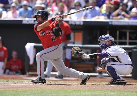 June 15, 2014: Texas Tech first baseman Eric Gutierez swings during the College World Series game between the TCU Horned Frogs and the Texas Tech Red Raiders at TD Ameritrade Park in Omaha, Nebraska. TCU won 3-2 (Photo by Dennis Hubbard/Icon SMI/Corbis via Getty Images)