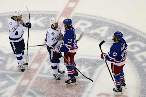 NEW YORK, NY – MAY 29: Steven Stamkos #91 of the Tampa Bay Lightning shakes hands with Ryan McDonagh #27 of the New York Rangers after the Lightning defeated the Rangers by a score of 2-0 to win Game Seven of the Eastern Conference Finals during the 2015 NHL Stanley Cup Playoffs at Madison Square Garden on May 29, 2015 in New York City. (Photo by Elsa/Getty Images)