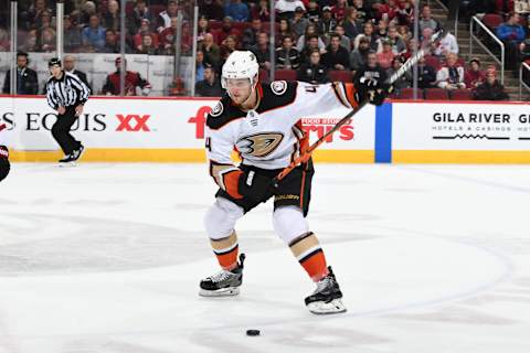 GLENDALE, ARIZONA – JANUARY 02: Cam Fowler #4 of the Anaheim Ducks shoots the puck up ice against the Arizona Coyotes at Gila River Arena on January 02, 2020, in Glendale, Arizona. (Photo by Norm Hall/NHLI via Getty Images)