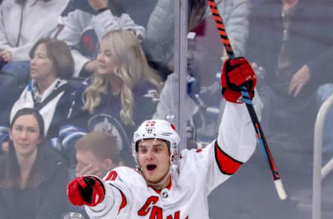 WINNIPEG, MB – DECEMBER 17: Sebastian Aho #20 of the Carolina Hurricanes celebrates a second period goal against the Winnipeg Jets at the Bell MTS Place on December 17, 2019 in Winnipeg, Manitoba, Canada. (Photo by Darcy Finley/NHLI via Getty Images)