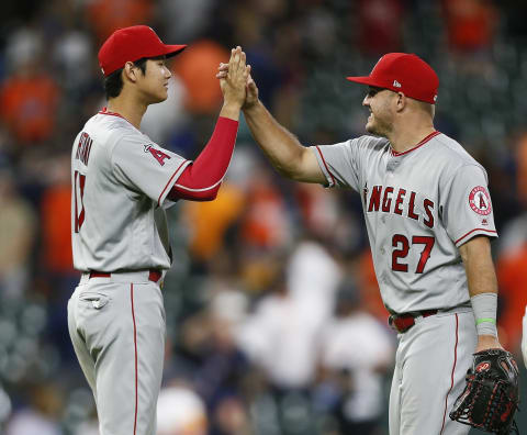 HOUSTON, TX – AUGUST 31: Mike Trout #27 of the Los Angeles Angels of Anaheim high fives Shohei Ohtani #17 after a 3-0 win over the Houston Astros at Minute Maid Park on August 31, 2018 in Houston, Texas. (Photo by Bob Levey/Getty Images)