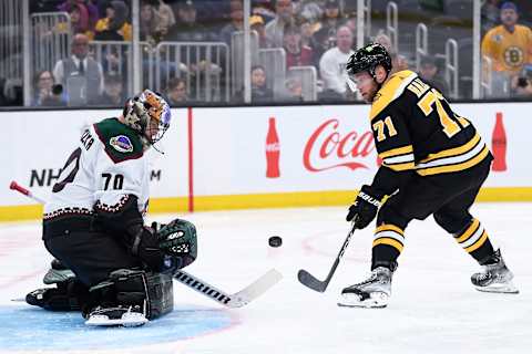 Oct. 15, 2022; Boston, Massachusetts, USA; Boston Bruins left wing Taylor Hall (71) shoots the puck on Arizona Coyotes goaltender Karel Vejmelka (70) during the third period at TD Garden. Mandatory Credit: Bob DeChiara-USA TODAY Sports