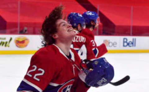 May 1, 2021; Montreal, Quebec, CAN; Montreal Canadiens forward Cole Caufield (22) reacts after scoring the winning goal against the Ottawa Senators during the overtime period at the Bell Centre. Mandatory Credit: Eric Bolte-USA TODAY Sports