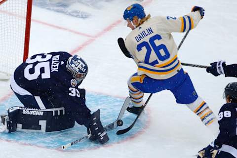 HAMILTON, ONTARIO – MARCH 13: Petr Mrazek #35 of the Toronto Maple Leafs blocks a shot by Rasmus Dahlin #26 of the Buffalo Sabres in the second period during the Heritage Classic at Tim Hortons Field on March 13, 2022 in Hamilton, Ontario. (Photo by Vaughn Ridley/Getty Images)