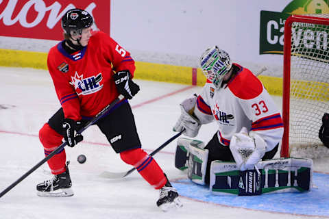 Jan 25, 2023; Langley, BC, CANADA; CHL Top Prospects team white goaltender Scott Ratzlaff (33) blocks a shot as CHL Top Prospects team red defenseman Etienne Morin (5) screens the net during the first period in the 2023 CHL Top Prospects ice hockey game at Langley Events Centre. Mandatory Credit: Anne-Marie Sorvin-USA TODAY Sports