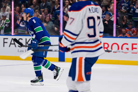 Oct 11, 2023; Vancouver, British Columbia, CAN; Edmonton Oilers forward Connor McDavid (97) watches as Vancouver Canucks forward Brock Boeser (6) celebrates his goal in the first period at Rogers Arena. Mandatory Credit: Bob Frid-USA TODAY Sports