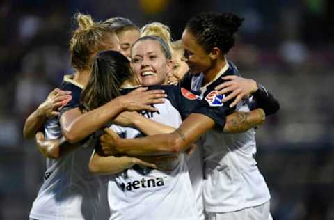 BOYDS, MD – JUNE 29: North Carolina Courage’s Merritt Mathias (11), Leah Pruitt (12), Lynn Williams (9), and McCall Zerboni (7) hug and celebrate with Debinha Miri (Débora Cristiane de Oliveira) (10) after her late first half goal during the National Womens Soccer League (NWSL) game between the North Carolina Courage and Washington Spirit June 29, 2019 at Maureen Hendricks Field at Maryland SoccerPlex in Boyds, MD. (Photo by Randy Litzinger/Icon Sportswire via Getty Images)