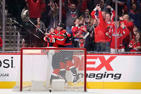 WASHINGTON, DC – JANUARY 05: Lars Eller #20 of the Washington Capitals celebrates with John Carlson #74 after scoring the game winning goal in overtime against the San Jose Sharks at Capital One Arena on January 5, 2020 in Washington, DC. (Photo by Patrick McDermott/NHLI via Getty Images)