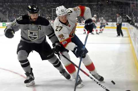 Feb 18, 2017; Los Angeles, CA, USA; Los Angeles Kings defenseman Drew Doughty (8) and Florida Panthers center Nick Bjugstad (27) battle for the puck in the first period of the game at Staples Center. Mandatory Credit: Jayne Kamin-Oncea-USA TODAY Sports