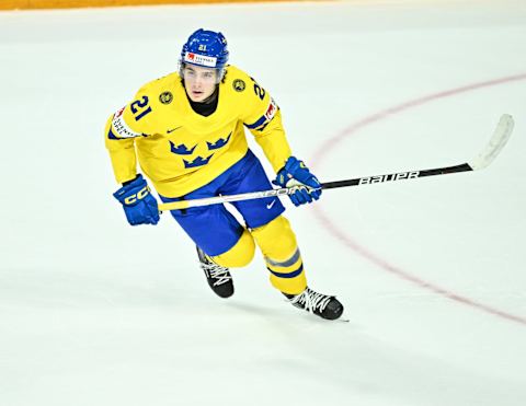 Leo Carlsson #21 of Team Sweden in the 2023 IIHF World Junior Championship (Photo by Minas Panagiotakis/Getty Images)