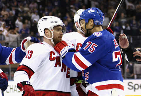 NEW YORK, NEW YORK – MAY 24: Ryan Reaves #75 of the New York Rangers confronts Max Domi #13 of the Carolina Hurricanes near the end of their game in Game Four of the Second Round of the 2022 Stanley Cup Playoffs at Madison Square Garden on May 24, 2022, in New York City. The Rangers defeated the Hurricanes 4-1. (Photo by Bruce Bennett/Getty Images)