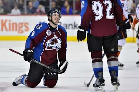 Apr 9, 2016; Denver, CO, USA; Colorado Avalanche center Matt Duchene (9) looks up at left wing Gabriel Landeskog (92) as he bleeds from the mouth after taking a high stick to the face from Anaheim Ducks defenseman Hampus Lindholm (47) (not pictured) in the third period at Pepsi Center. The Ducks defeated the Avalanche 5-3. Mandatory Credit: Ron Chenoy-USA TODAY Sports