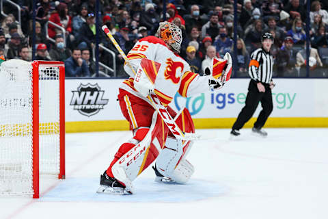 Jan 26, 2022; Columbus, Ohio, USA; Calgary Flames goaltender Jacob Markstrom (25) makes a glove save against the Columbus Blue Jackets in the second period at Nationwide Arena. Mandatory Credit: Aaron Doster-USA TODAY Sports