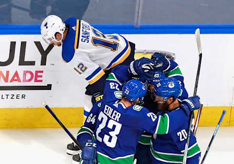 The Canucks celebrate a goal vs the Blues in Round 1 of 2020 Stanley Cup Playoffs (Photo by Jeff Vinnick/Getty Images)