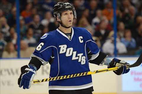 Jan 18, 2014; Tampa, FL, USA; Tampa Bay Lightning right wing Martin St. Louis (26) prepares for a face off during the third period against the San Jose Sharks at Tampa Bay Times Forum. Mandatory Credit: Jonathan Dyer-USA TODAY Sports