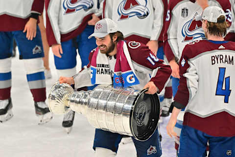 Alex Newhook lifts the Stanley Cup after defeating the Tampa Bay Lightning in Game Six of the 2022 NHL Stanley Cup Final. (Photo by Julio Aguilar/Getty Images)