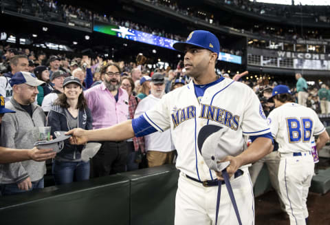 SEATTLE, WA – SEPTEMBER 30: Nelson Cruz #23 of the Seattle Mariners hands out souvenirs after the final game of the season against the Texas Rangers at Safeco Field on September 30, 2018 in Seattle, Washington. The Mariners won the game 3-1. (Photo by Stephen Brashear/Getty Images)