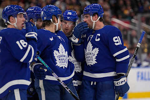 Feb 1, 2023; Toronto, Ontario, CAN; Toronto Maple Leafs forward John Tavares (91), defenseman Rasmus Sandin (38), forward William Nylander (88) and forward Mitchell Marner (16) huddle up during a break in the action against the Boston Bruins during the third period at Scotiabank Arena. Mandatory Credit: John E. Sokolowski-USA TODAY Sports