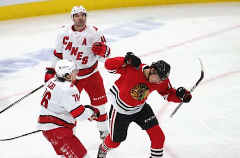 CHICAGO, ILLINOIS – FEBRUARY 02: Dylan Strome #17 of the Chicago Blackhawks celebrates scoring the game-tying goal in from of Jordan Martinook #48 and Brady Skjei #76 of the Carolina Hurricanes at the United Center on February 02, 2021, in Chicago, Illinois. The Hurricanes defeated the Blackhawks 4-3 in a shootout. (Photo by Jonathan Daniel/Getty Images)