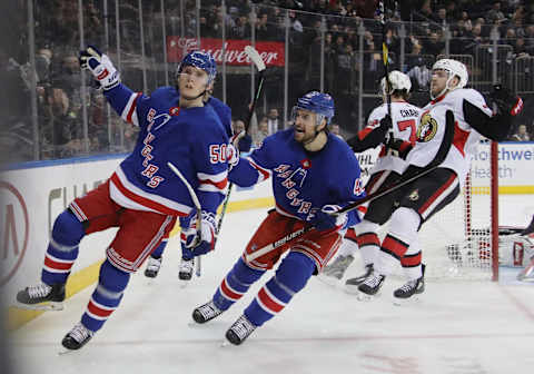 NEW YORK, NEW YORK – APRIL 03: Lias Andersson #50 of the New York Rangers (l) scores a short-handed goal at 4:52 of the second period against the Ottawa Senators and is joined by Brendan Smith #42 (r) at Madison Square Garden on April 03, 2019 in New York City. (Photo by Bruce Bennett/Getty Images)