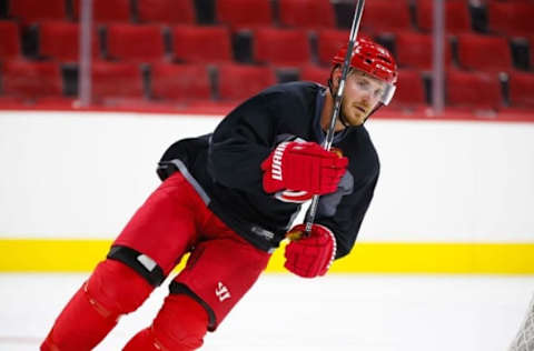 Sept 18, 2015; Raleigh, NC, USA; Carolina Hurricanes defensemen James Wisniewski (21) skates during training camp at PNC Arena. Mandatory Credit: James Guillory-USA TODAY Sports