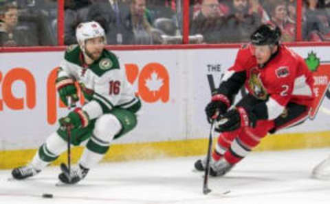 Nov 13, 2016; Ottawa, Ontario, CAN; Minnesota Wild left wing Jason Zucker (16) skates with the puck in front of Ottawa Senators defenseman Dion Phaneuf (2) in the first period at Canadian Tire Centre. Mandatory Credit: Marc DesRosiers-USA TODAY Sports