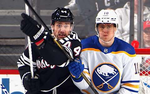 NEWARK, NEW JERSEY – APRIL 11: Henri Jokiharju #10 of the Buffalo Sabres defends against Miles Wood #44 of the New Jersey Devils during the first period at the Prudential Center on April 11, 2023 in Newark, New Jersey. (Photo by Bruce Bennett/Getty Images)