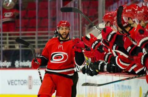 Jan 31, 2021; Raleigh, North Carolina, USA; Carolina Hurricanes center Vincent Trocheck (16) scores the game winning shootout goal against Dallas Stars at PNC Arena. Mandatory Credit: James Guillory-USA TODAY Sports