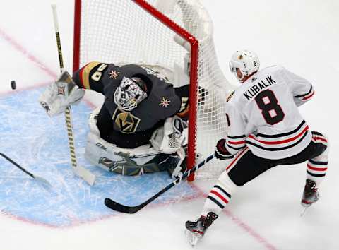 Robin Lehner #90 of the Vegas Golden Knights deflects a shot by Dominik Kubalik #8 of the Chicago Blackhawks in Game One of the Western Conference First Round. (Photo by Jeff Vinnick/Getty Images)