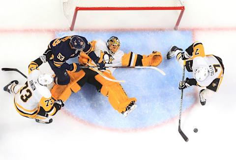 BUFFALO, NY – MARCH 14: Matt Cullen #7 and Casey DeSmith of the Pittsburgh Penguins defend the puck against Jeff Skinner #53 of the Buffalo Sabres during an NHL game on March 14, 2019 at KeyBank Center in Buffalo, New York. Pittsburgh won, 5-0. (Photo by Bill Wippert/NHLI via Getty Images)