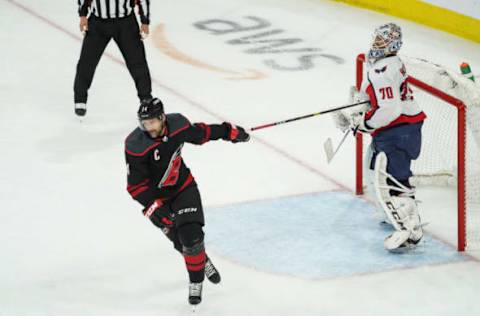 RALEIGH, NC – APRIL 22: Washington Capitals goaltender Braden Holtby (70) grabs hold of the stick of Carolina Hurricanes Right Wing Justin Williams (14) during a game between the Carolina Hurricanes and the Washington Capitals on April 22, 2019 at the PNC Arena in Raleigh, NC. (Photo by Greg Thompson/Icon Sportswire via Getty Images)