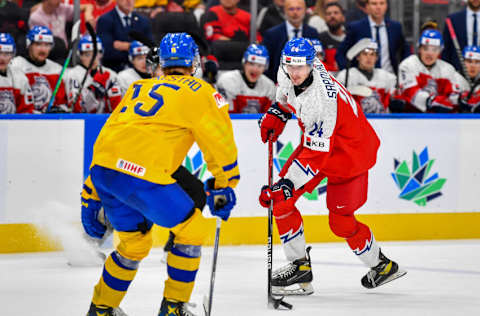 EDMONTON, AB – AUGUST 20: Matyas Sapovaliv #24 of Czechia carries the puck up the ice while Ake Stakkestad #15 of Sweden defends during second period action in the 2022 IIHF World Junior Championship bronze medal game at Rogers Place on August 20, 2022 in Edmonton, Alberta, Canada. (Photo by Andy Devlin/Getty Images)