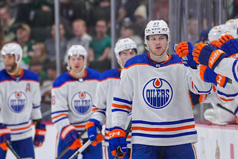 Oct 24, 2023; Saint Paul, Minnesota, USA; Edmonton Oilers left wing Warren Foegele (37) celebrates his goal against the Minnesota Wild in the second period at Xcel Energy Center. Mandatory Credit: Brad Rempel-USA TODAY Sports