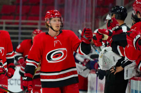 Feb 15, 2021; Raleigh, North Carolina, USA; Carolina Hurricanes left wing Brock McGinn (23) celebrates his third period goal against the Columbus Blue Jackets at PNC Arena. Mandatory Credit: James Guillory-USA TODAY Sports