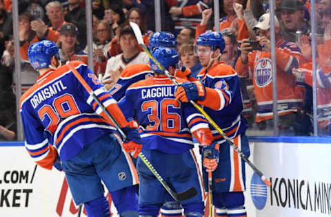 Apr 9, 2017; Edmonton, Alberta, CAN; Edmonton Oilers center Drake Caggiula (36) celebrates his second period goal with Edmonton Oilers center Connor McDavid (97) against the Vancouver Canucks at Rogers Place. Mandatory Credit: Candice Ward-USA TODAY Sports