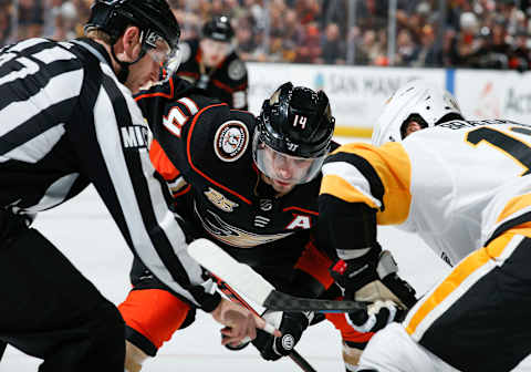 ANAHEIM, CA – JANUARY 11: Linesman Devin Berg #87 prepares to drop a puck for a face-off between Adam Henrique #14 of the Anaheim Ducks and Derick Brassard #19 of the Pittsburgh Penguins during the third period of the game at Honda Center on January 11, 2019 in Anaheim, California. (Photo by Debora Robinson/NHLI via Getty Images)