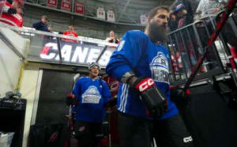 Jan 10, 2023; Raleigh, North Carolina, USA; Carolina Hurricanes defenseman Brent Burns (8) and center Seth Jarvis (24) go out onto the ice before the game against the New Jersey Devils at PNC Arena. Mandatory Credit: James Guillory-USA TODAY Sports